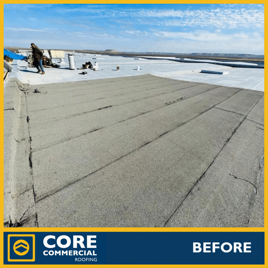 Black EPDM rubber membrane surface on a low-slope commercial roof in West Texas, seam-taped and smooth